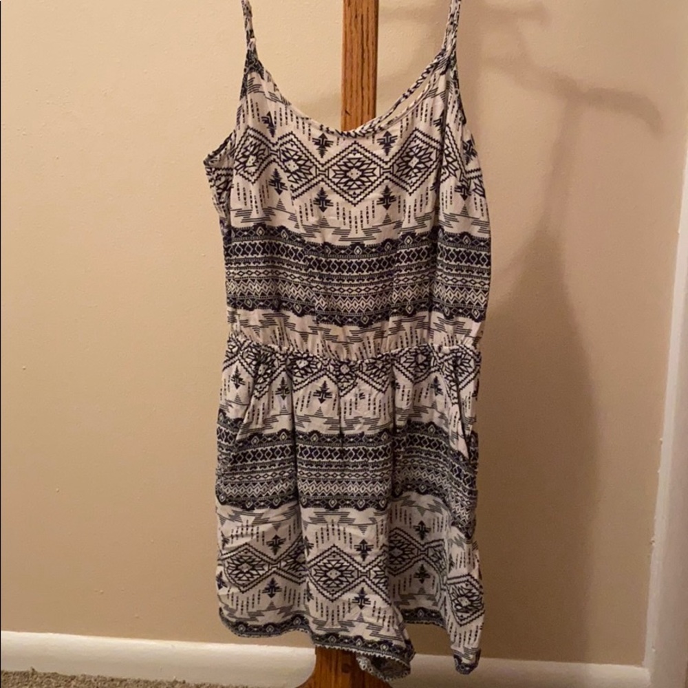 Black and white romper. Crisscross back. Pockets